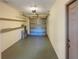 One car garage with shelving and storage space at 4185 Barracuda Se Dr, St Petersburg, FL 33705