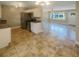 Open kitchen features stainless steel appliances and tile floors at 4185 Barracuda Se Dr, St Petersburg, FL 33705