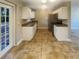 Modern kitchen with white cabinets, granite counters, and stainless steel appliances at 4185 Barracuda Se Dr, St Petersburg, FL 33705