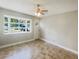 Bright living room with tile floors and large window at 4185 Barracuda Se Dr, St Petersburg, FL 33705