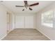 Bedroom with double closets and wood-look flooring at 3703 Coppertree Cir, Brandon, FL 33511