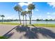 Scenic waterfront view with palm trees and calm waters at 307 161St Ave, Redington Beach, FL 33708