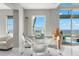 Bright dining area with glass table and chairs, offering stunning water views at 200 Colony Point S Rd, St Petersburg, FL 33705