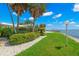 Landscaped waterfront lot with lush tropical plants at 200 Colony Point S Rd, St Petersburg, FL 33705