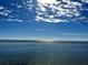 Bright, sunny waterfront view with clear skies and calm water at 200 Colony Point S Rd, St Petersburg, FL 33705