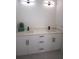 Double vanity bathroom with white cabinets and quartz countertops at 23335 Mac Dougall Ave, Port Charlotte, FL 33980