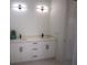 Double vanity bathroom with white cabinets and quartz countertops at 23335 Mac Dougall Ave, Port Charlotte, FL 33980