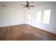 Spacious bedroom with wood flooring and access to the outdoors at 23335 Mac Dougall Ave, Port Charlotte, FL 33980