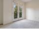 Bright bedroom with French doors leading to balcony at 1344 Ribolla Dr, Palm Harbor, FL 34683