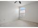 Bright bedroom with carpeted floor, ceiling fan, and large window at 1344 Ribolla Dr, Palm Harbor, FL 34683