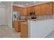 Kitchen with stainless steel appliances and granite countertops at 1344 Ribolla Dr, Palm Harbor, FL 34683