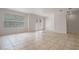 Living room with tile floors and access to the outdoors at 1344 Ribolla Dr, Palm Harbor, FL 34683