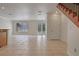 Living room with tile floors and French doors leading outside at 1344 Ribolla Dr, Palm Harbor, FL 34683