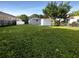 Spacious backyard with grassy area and storage shed at 1220 36Th W Ave, Bradenton, FL 34205