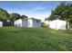 Large backyard with grassy area and storage shed at 1220 36Th W Ave, Bradenton, FL 34205
