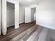Spacious bedroom with vinyl plank flooring and mirrored closet doors at 1220 36Th W Ave, Bradenton, FL 34205
