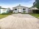 Newly renovated house with a gravel driveway and fenced yard at 1220 36Th W Ave, Bradenton, FL 34205