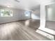 Bright living room features wood-look floors and an open floor plan at 1220 36Th W Ave, Bradenton, FL 34205