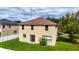 Backyard of two-story home with grass at 10617 Bamboo Rod Cir, Riverview, FL 33569