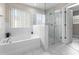 Bathroom features a soaking tub and a separate glass shower at 10617 Bamboo Rod Cir, Riverview, FL 33569