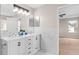 Double sink bathroom with marble accents and updated fixtures at 10617 Bamboo Rod Cir, Riverview, FL 33569