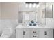 Double vanity bathroom with marble countertops and modern lighting at 10617 Bamboo Rod Cir, Riverview, FL 33569