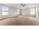 Spacious bedroom with neutral walls, carpet, and multiple windows at 10617 Bamboo Rod Cir, Riverview, FL 33569