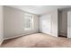 Simple bedroom with carpeted floor and double door closet at 10617 Bamboo Rod Cir, Riverview, FL 33569
