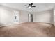 Spacious bedroom with neutral carpeting and ceiling fan at 10617 Bamboo Rod Cir, Riverview, FL 33569