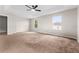 Bright bedroom featuring neutral walls and carpet, plus a ceiling fan at 10617 Bamboo Rod Cir, Riverview, FL 33569