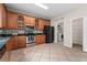 Kitchen with stainless steel appliances and laundry area at 10617 Bamboo Rod Cir, Riverview, FL 33569