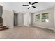 Living room with tile floors and access to the front door and stairs at 10617 Bamboo Rod Cir, Riverview, FL 33569