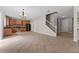 Open floor plan with kitchen, living room, and staircase at 10617 Bamboo Rod Cir, Riverview, FL 33569