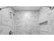 Modern shower with marble-style tile and a niche at 10617 Bamboo Rod Cir, Riverview, FL 33569