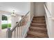 Carpeted staircase leading to the upper level at 10617 Bamboo Rod Cir, Riverview, FL 33569