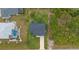 Bird's eye view of home with driveway and green space at 10071 Kingsville Dr, Port Charlotte, FL 33981