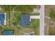 Overhead view of house and surrounding landscape at 10071 Kingsville Dr, Port Charlotte, FL 33981