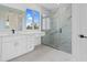 Modern bathroom with walk-in shower and marble tile at 10071 Kingsville Dr, Port Charlotte, FL 33981