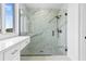 Large walk-in shower with marble tile and glass at 10071 Kingsville Dr, Port Charlotte, FL 33981