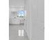 Elegant bathroom with white cabinets and marble floors at 10071 Kingsville Dr, Port Charlotte, FL 33981