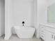 Bathroom with freestanding tub and vanity at 10071 Kingsville Dr, Port Charlotte, FL 33981