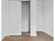 Bright bedroom with sliding door closet and wood-look floors at 10071 Kingsville Dr, Port Charlotte, FL 33981