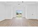 Bright and airy bedroom with hardwood floors and French doors at 10071 Kingsville Dr, Port Charlotte, FL 33981