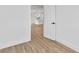 Bedroom with view of kitchen and wood-look floors at 10071 Kingsville Dr, Port Charlotte, FL 33981