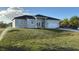 New home with a lush green lawn, and a built-in one car garage at 10071 Kingsville Dr, Port Charlotte, FL 33981