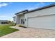 House exterior with paved driveway at 10071 Kingsville Dr, Port Charlotte, FL 33981