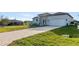 Newly constructed home with a paver driveway and landscaped lawn at 10071 Kingsville Dr, Port Charlotte, FL 33981