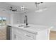 Modern kitchen island with double sink and sleek black faucet at 10071 Kingsville Dr, Port Charlotte, FL 33981