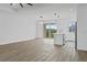 Open concept kitchen with island and modern lighting at 10071 Kingsville Dr, Port Charlotte, FL 33981