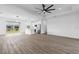 Open concept living room with hardwood floors and kitchen views at 10071 Kingsville Dr, Port Charlotte, FL 33981